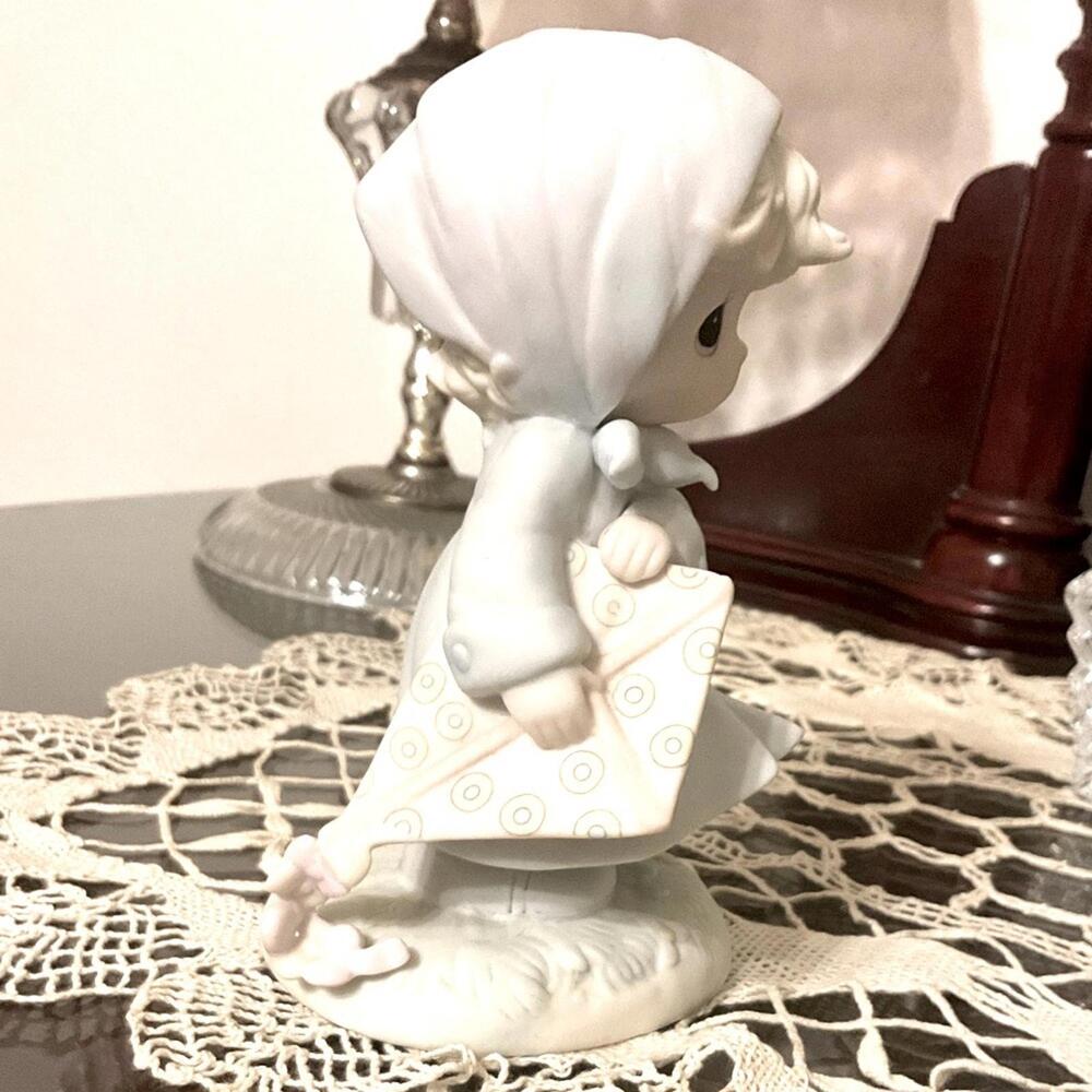 Vintage Precious Moments March Birthday Month figurine.